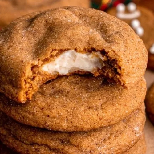Delicious gingerbread cheesecake cookies on a plate, perfect for holiday baking.