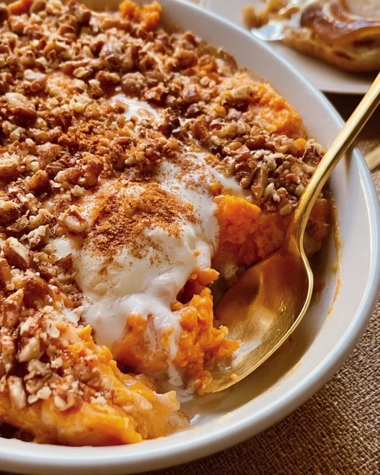 Delicious sweet potato casserole topped with marshmallows and pecans