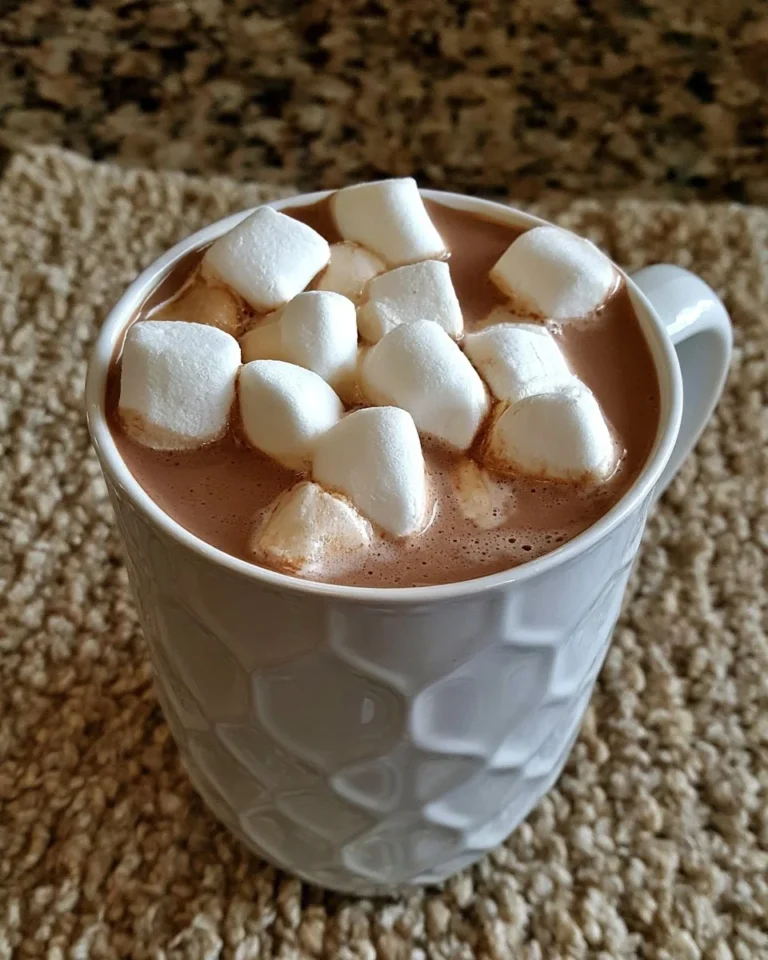 Delicious homemade hot chocolate topped with whipped cream and chocolate shavings