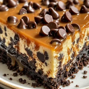 Easy homemade caramel chocolate chip cheesecake topped with caramel and chocolate chips